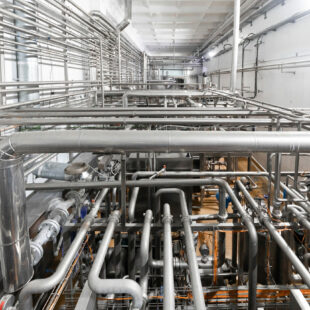 Cheese industry interior and production of hard cheese background